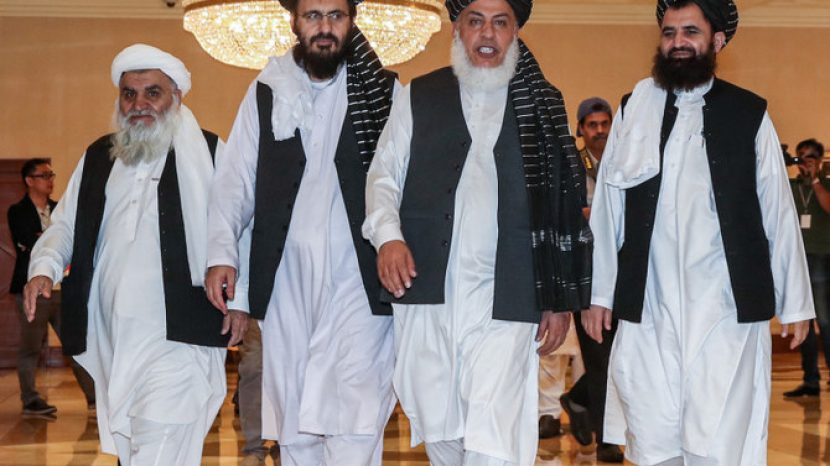 Mohammad Nabi Omari (C-L), a Taliban member formerly held by the US at Guantanamo Bay and reportedly released in 2014 in a prisoner exchange, Taliban negotiator Abbas Stanikzai (C-R), and former Taliban intelligence deputy Mawlawi Abdul Haq Wasiq (R) walk with another Taliban member during the second day of the Intra Afghan Dialogue talks in the Qatari capital Doha on July 8, 2019. - Dozens of powerful Afghans met with a Taliban delegation on July 8, amid separate talks between the US and the insurgents seeking to end 18 years of war. The separate intra-Afghan talks are attended by around 60 delegates, including political figures, women and other Afghan stakeholders. (Photo by KARIM JAAFAR / AFP)        (Photo credit should read KARIM JAAFAR/AFP/Getty Images)