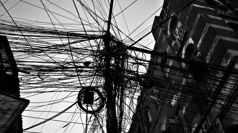 An_electric_pole,_behind_office_buildings,_at_kolkata